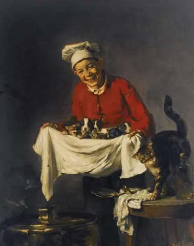 Een jongen met honden en kittens