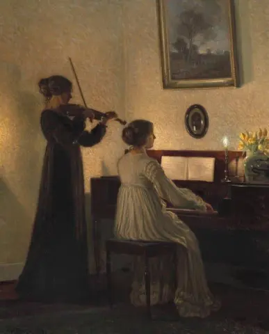 Interior With Two Women Playing Music By Candlelight 1918