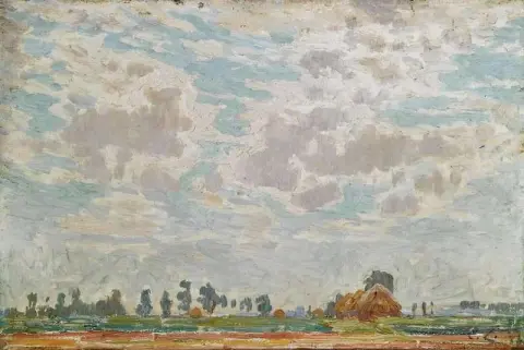ベルギーの農家の上の曇った空