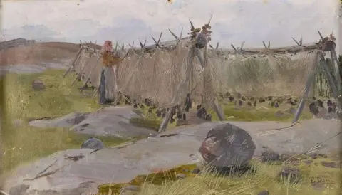 Meisje dat de visnetten schoonmaakt