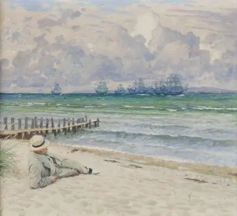 En Man På Stranden