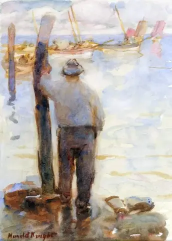 Fisherman Looking Out To Sea Cobbles And Fishing Fleet In The Distance