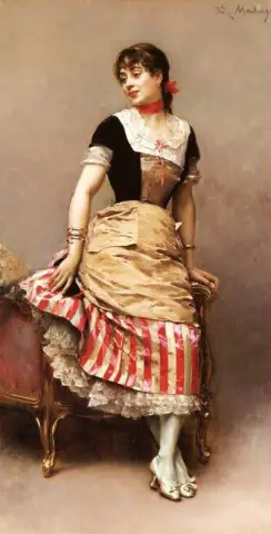Um retrato de Aline Masson encostada em um sofá