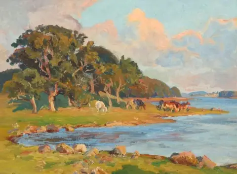 Een zomerlandschap met koeien aan de oevers van een kreek