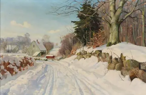 Uma estrada através de uma paisagem coberta de neve