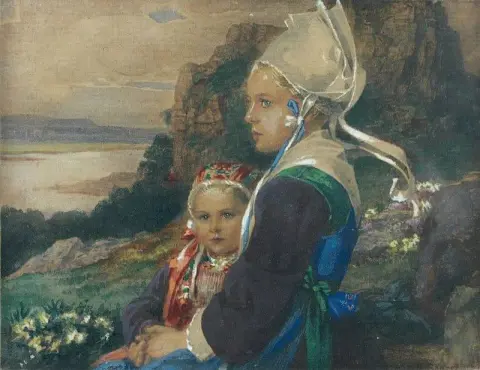 Bretonne e sua garota na orla costeira