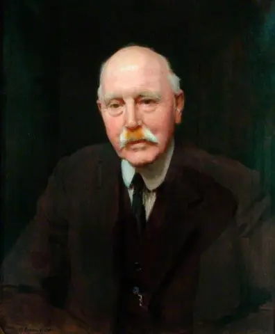 John E. Shaw JP-voorzitter